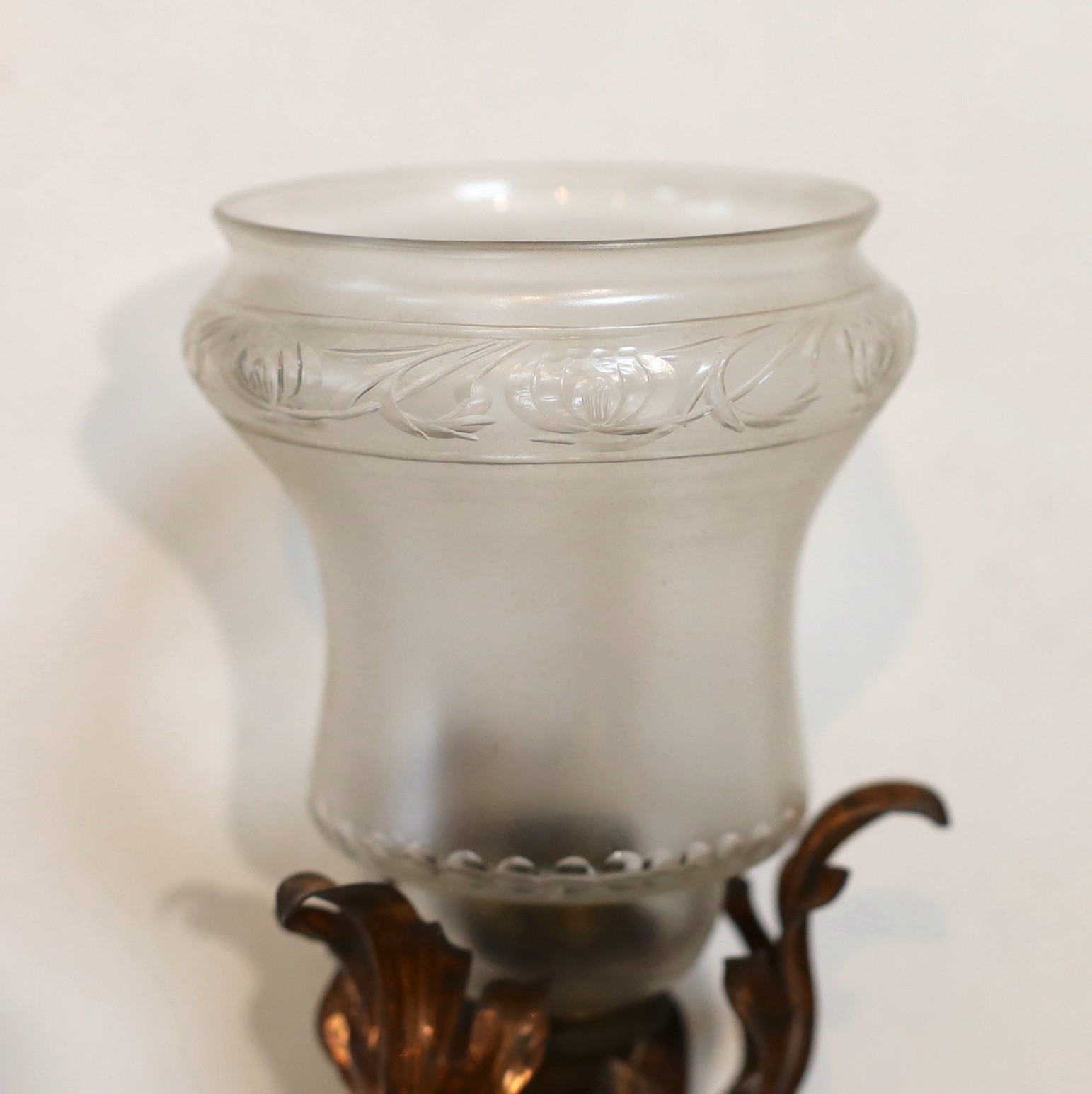 An English Arts & Crafts copper and brass wall light with cut and frosted glass shade, 22cm